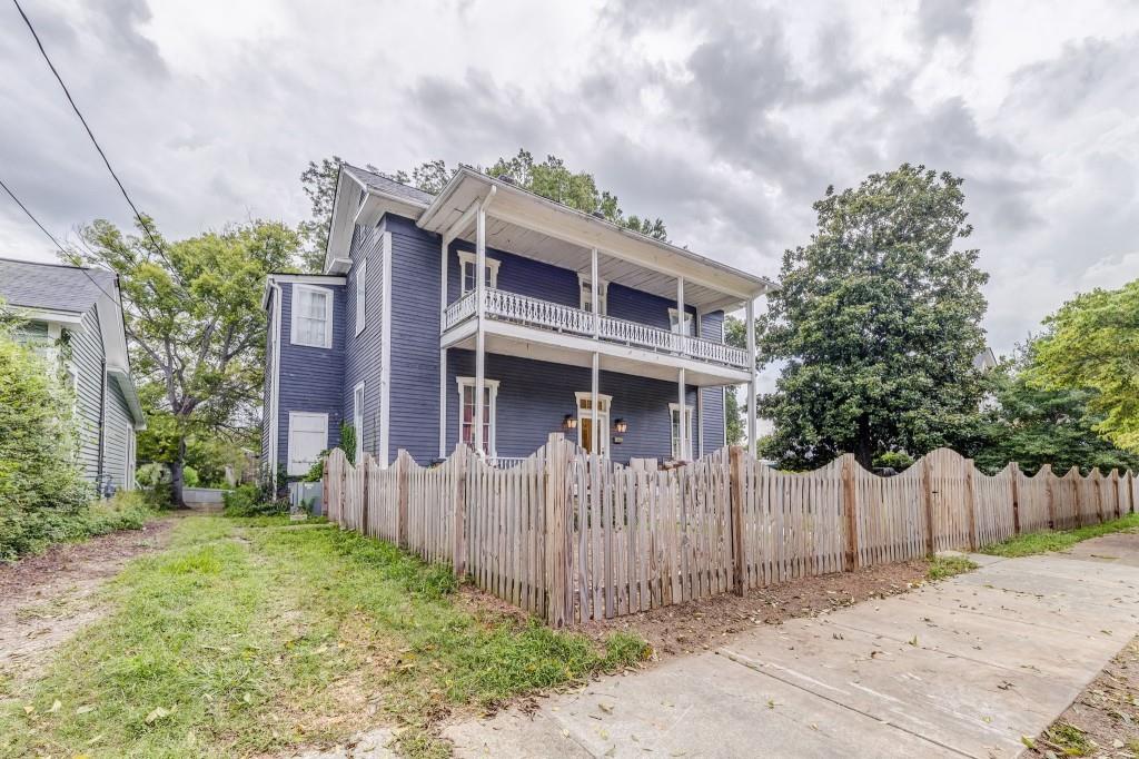 1006 Avenue A Rome, GA 30165 - Photo 6 of 61 a front view of a house with a garden