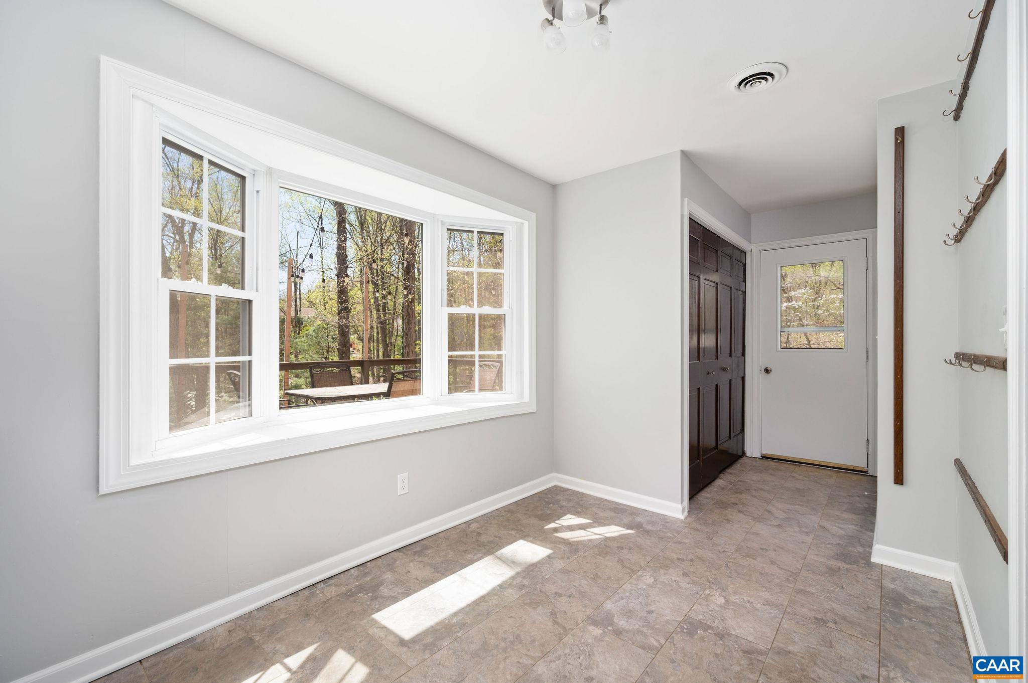 104 Smithfield Court, Unit A Charlottesville, VA 22901 - Photo 9 of 25 a view of an empty room with a window