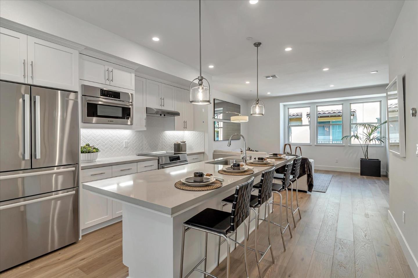 1277 Verano Road Mountain View, CA 94043 - Photo 12 of 52 a kitchen with stainless steel appliances granite countertop a stove refrigerator and a table with wooden floor