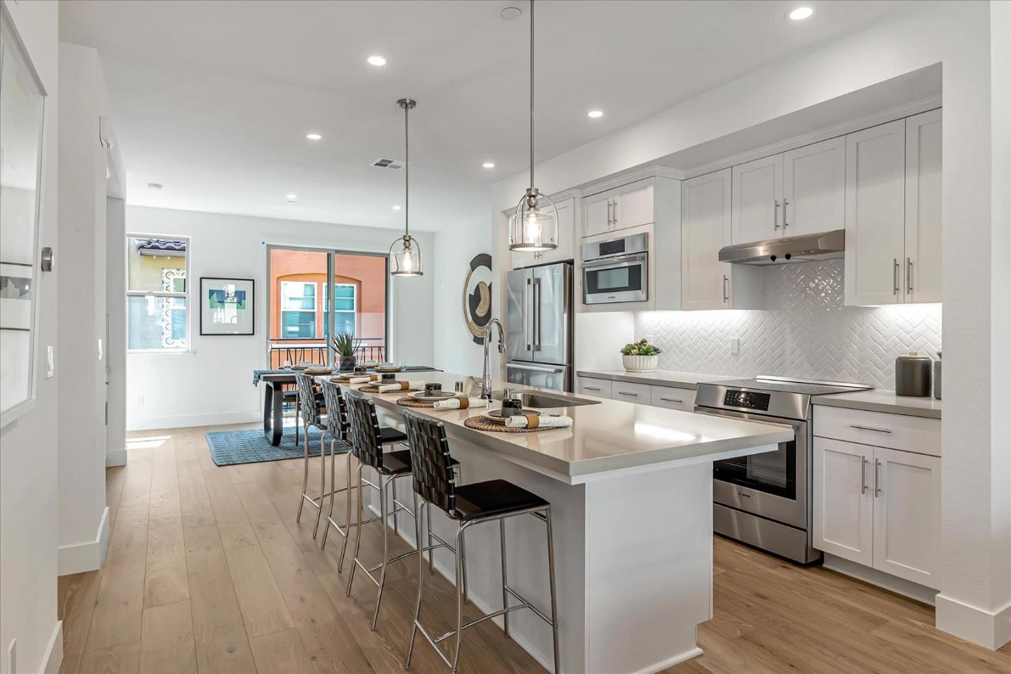 1277 Verano Road Mountain View, CA 94043 - Photo 13 of 52 a kitchen with stainless steel appliances granite countertop a sink stove and refrigerator