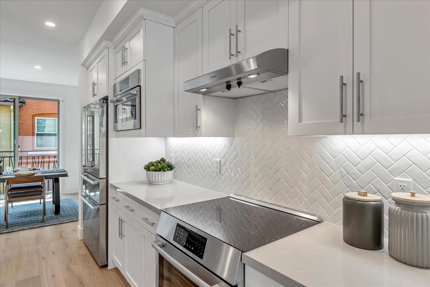 1277 Verano Road Mountain View, CA 94043 - Photo 17 of 52 a kitchen with stainless steel appliances granite countertop a sink and a stove