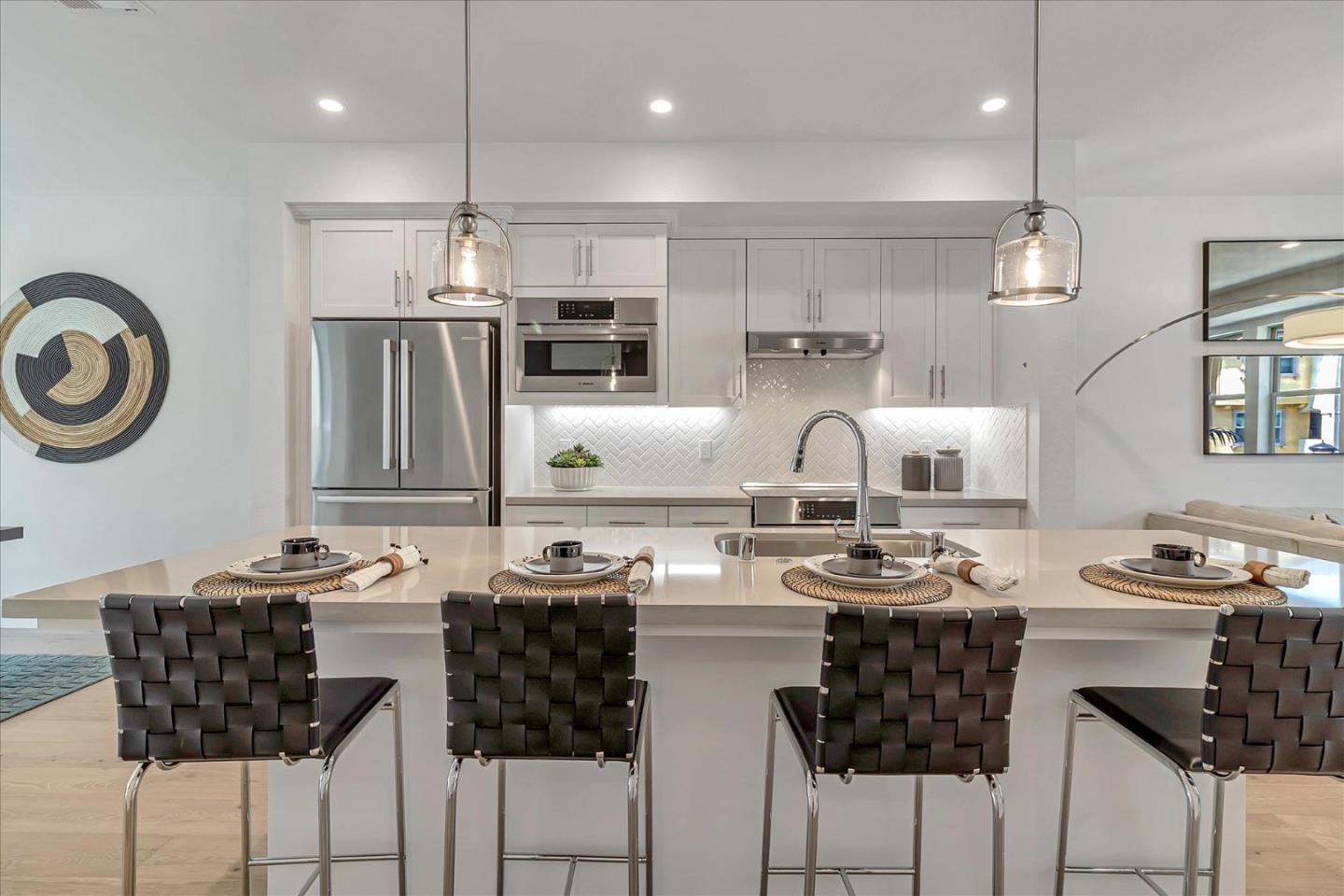 1277 Verano Road Mountain View, CA 94043 - Photo 18 of 52 a kitchen with stainless steel appliances kitchen island granite countertop a sink a stove a refrigerator and chairs