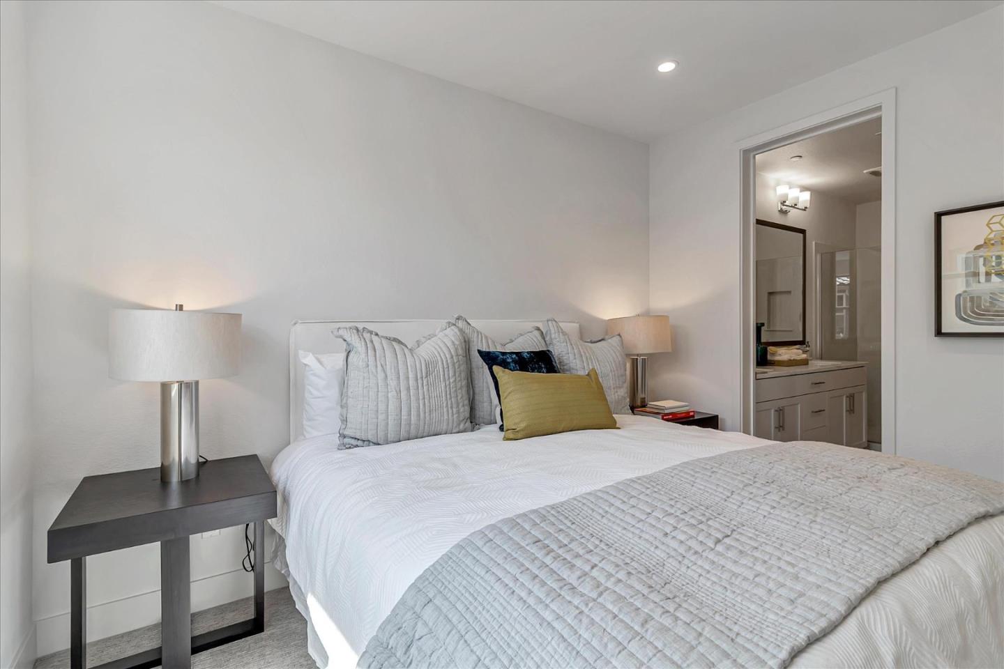 1277 Verano Road Mountain View, CA 94043 - Photo 27 of 52 a large bedroom with a bed and lamp