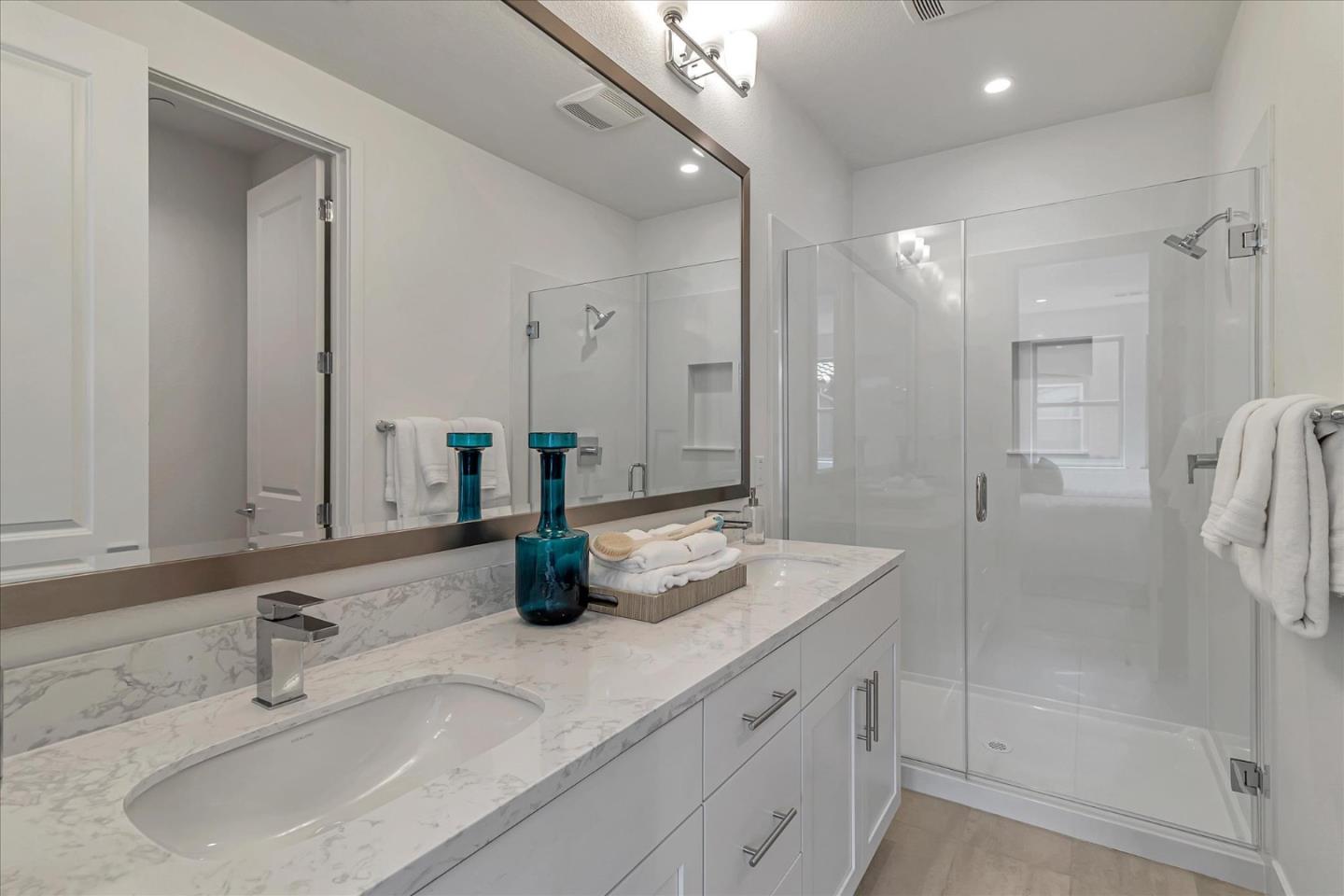 1277 Verano Road Mountain View, CA 94043 - Photo 41 of 52 a bathroom with double vanity sinks and a shower
