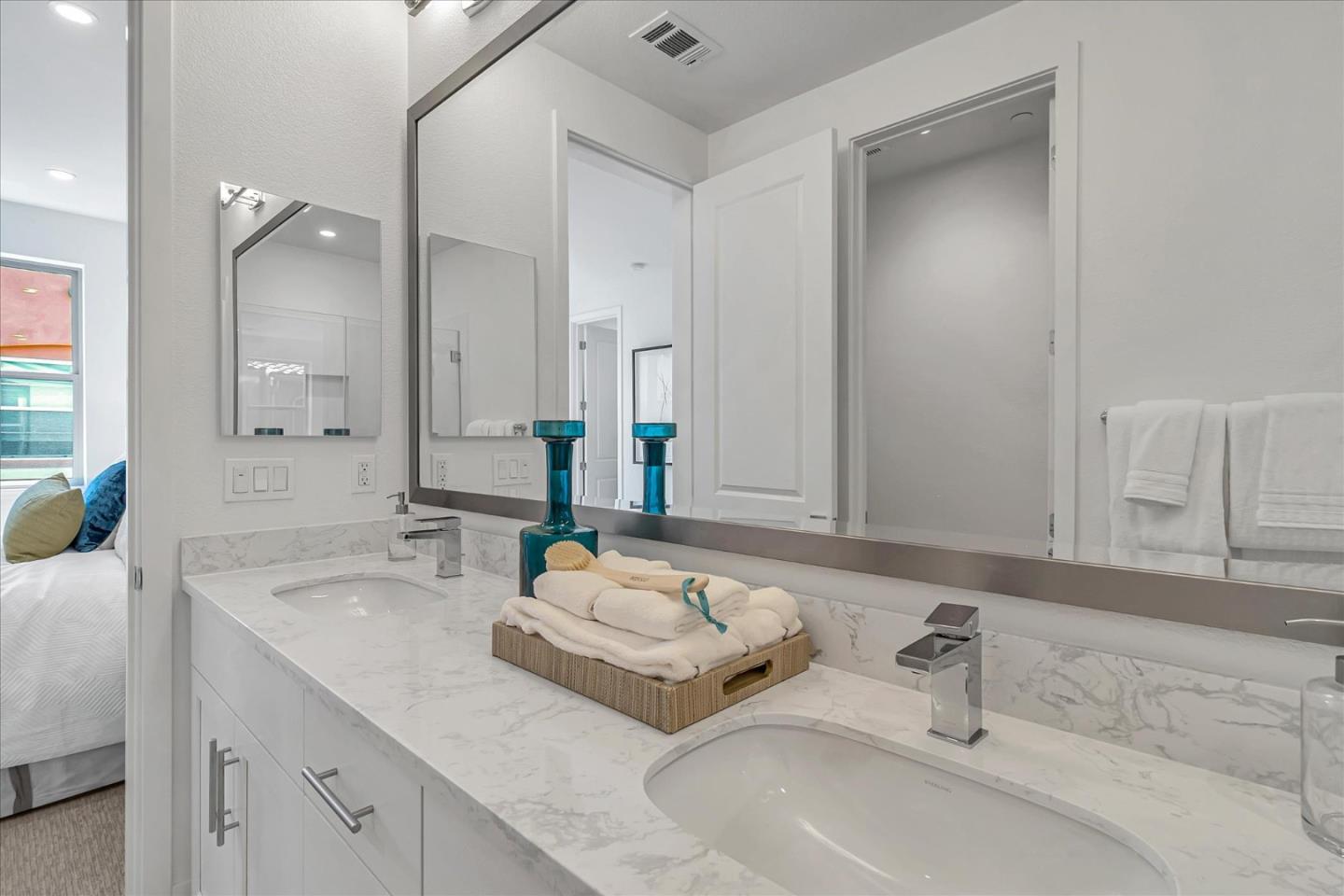 1277 Verano Road Mountain View, CA 94043 - Photo 42 of 52 a bathroom with double vanity sinks and a mirror