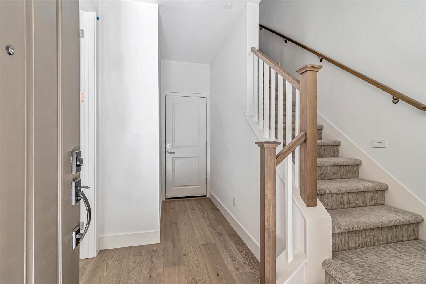 1277 Verano Road Mountain View, CA 94043 - Photo 5 of 52 a view of staircase with wooden floor and white walls