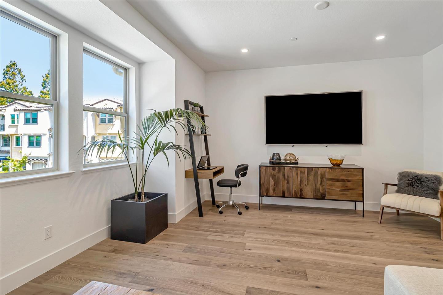 1277 Verano Road Mountain View, CA 94043 - Photo 10 of 52 a living room with furniture and a flat screen tv