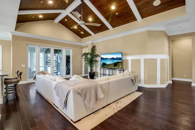 a view of a dining room with furniture wooden floor and chandelier