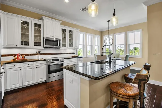 a view of a house with a yard and sitting area