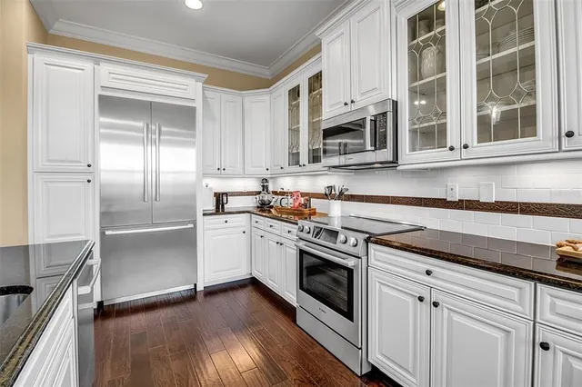 an aerial view of a house with garden space and lake view
