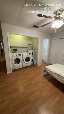 a spacious bedroom with a bed and cabinets