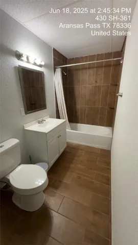a bathroom with a toilet a sink and a shower