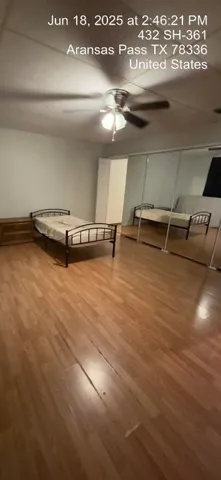 an empty room with wooden floor