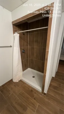 a bathroom with a tub and a shower