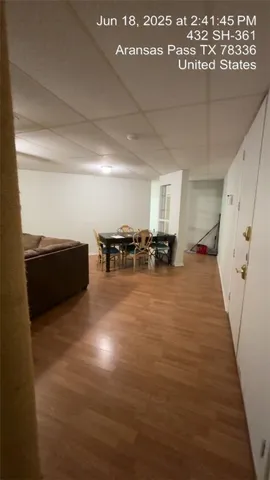 a view of kitchen with furniture and wooden floor