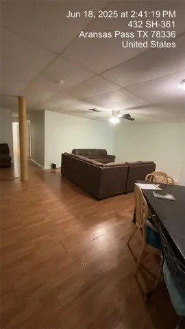 a room with furniture and a air conditioner vent