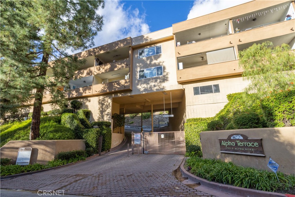 a view of a building with a yard