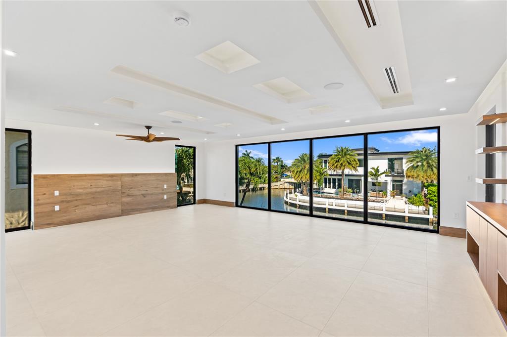 2441 Northeast 48th Court Lighthouse Point, FL 33064 - Photo 42 of 54 a view of an empty room with a balcony