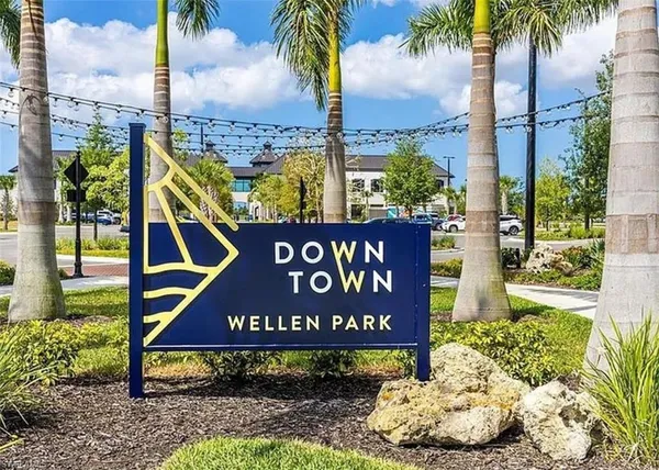 a view of a swimming pool with an ocean and trees