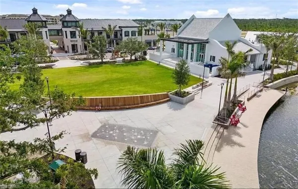 an aerial view of a residential houses with swimming pool and outdoor space