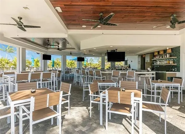 a view of swimming pool with outdoor seating and plants