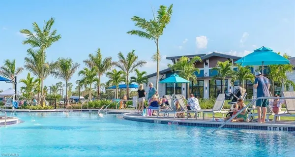 a house with swimming pool in front