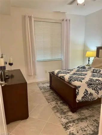 a bathroom with a sink a toilet a mirror and shower