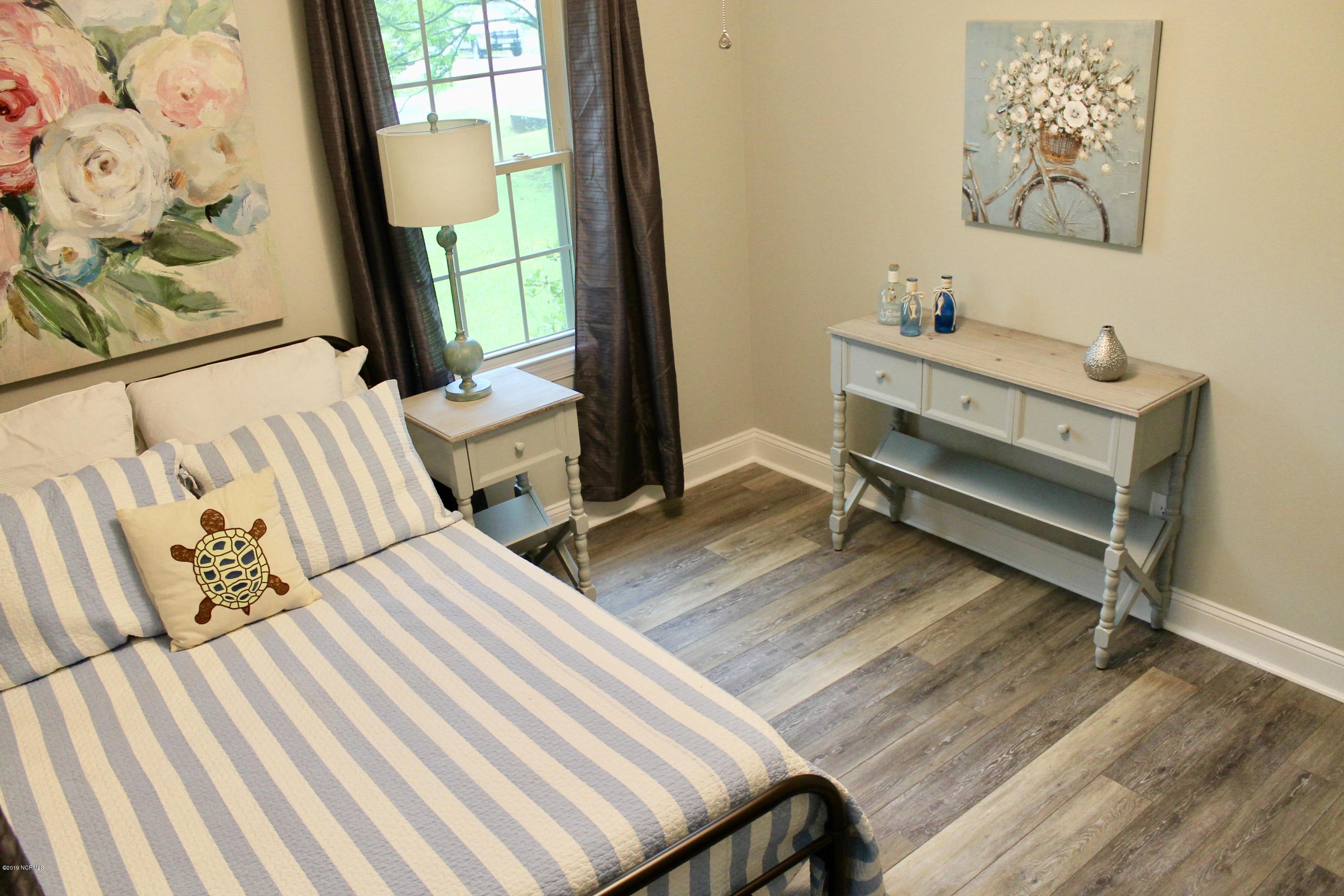 806 Spring Valley Road Wilmington, NC 28405 - Photo 7 of 20 2nd bedroom with easy care LVT floors.