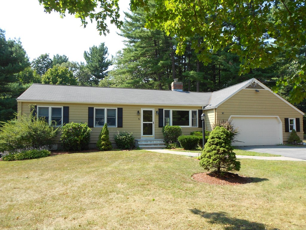 5 Singlefoot Road Chelmsford, MA 01824 - Photo 1 of 9 a front view of a house with a yard
