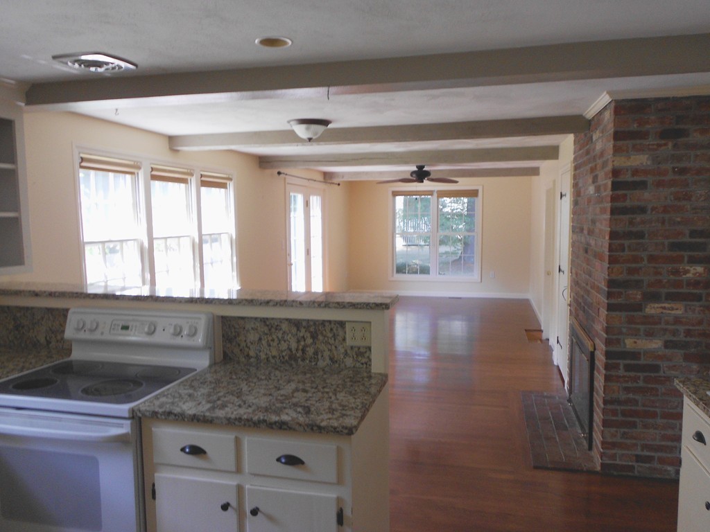 5 Singlefoot Road Chelmsford, MA 01824 - Photo 2 of 9 a kitchen with granite countertop a sink stove and cabinets