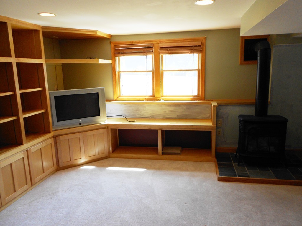 5 Singlefoot Road Chelmsford, MA 01824 - Photo 9 of 9 a view of an empty room with a window and a kitchen