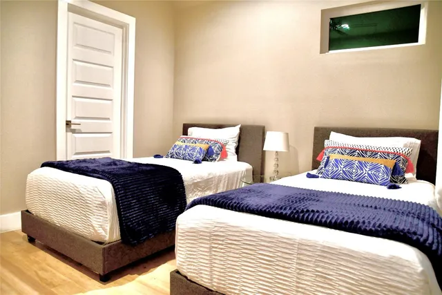 a view of a chair and table in backyard of the house