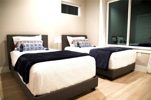 a view of backyard with table and chairs and a large tree