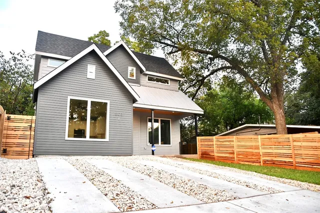 a living room with furniture a rug and a painting on the wall