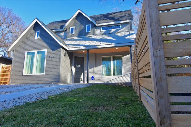 a living room with furniture and a painting on the wall