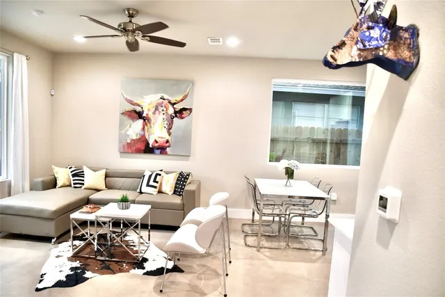 a kitchen with stainless steel appliances granite countertop a refrigerator a stove a microwave and a sink