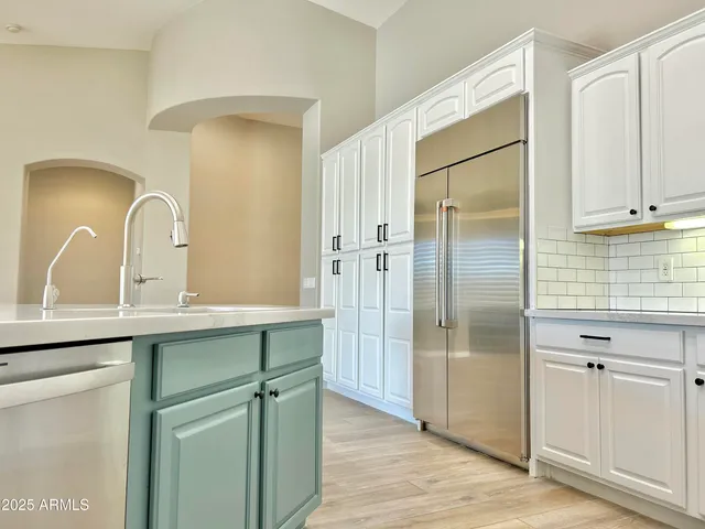 a bathroom with a double vanity sink mirror and shower