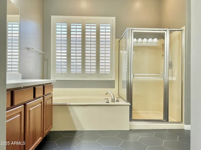 a bath tub sitting next to a window