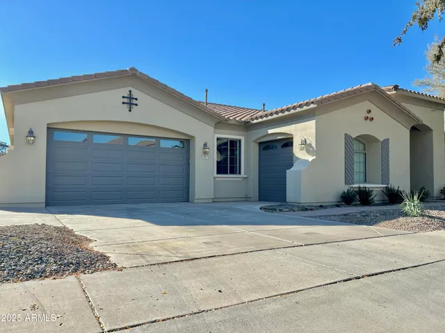 a view of front door and a garage