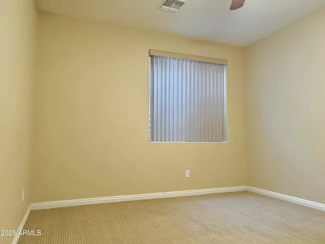 an empty room with closet area