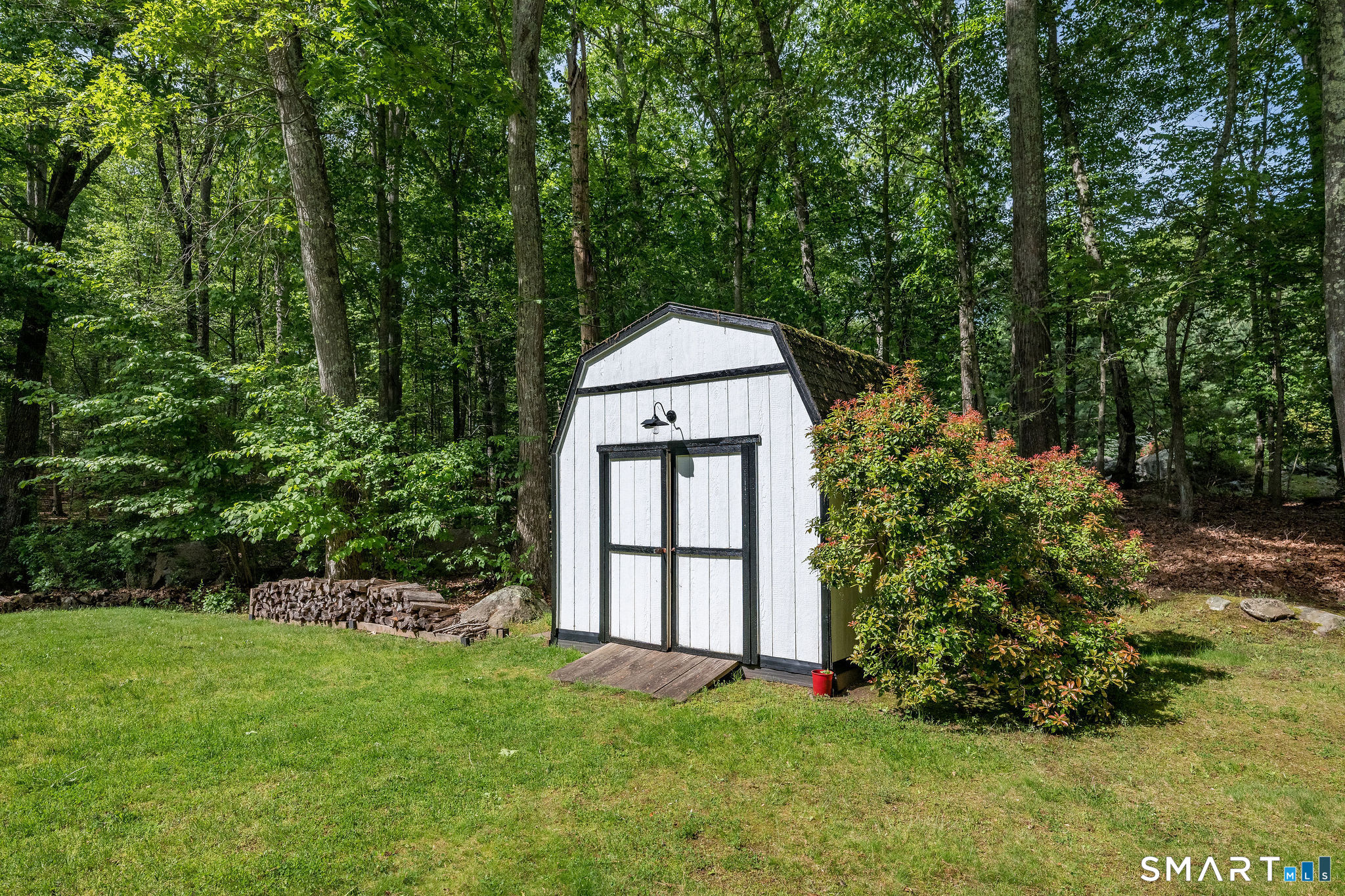 60 Bradley Corners Road Madison, CT 06443 - Photo 25 of 33 front view of a house with a yard
