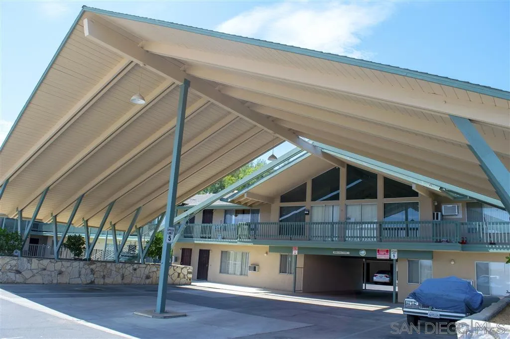 1433 South Mission Road Fallbrook, CA 92028 - Photo 3 of 12 a roof deck with table and chairs under an umbrella