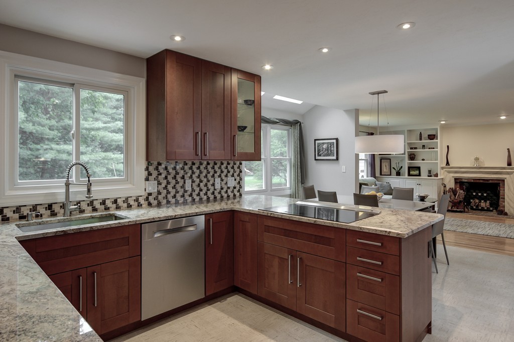 37 Edgewood Road Southborough, MA 01772 - Photo 13 of 29 a kitchen with a sink and wooden cabinets