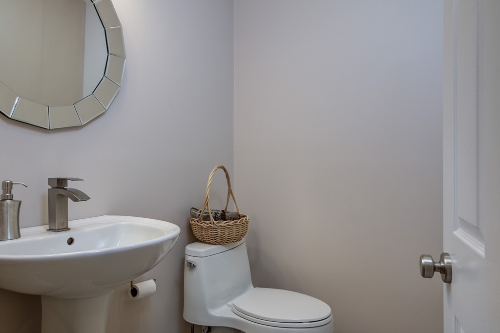 37 Edgewood Road Southborough, MA 01772 - Photo 15 of 29 a bathroom with a toilet sink and mirror