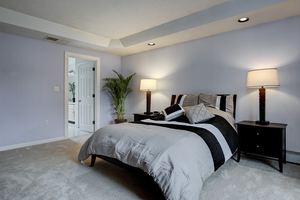 37 Edgewood Road Southborough, MA 01772 - Photo 20 of 29 a spacious bedroom with a bed and a lamp