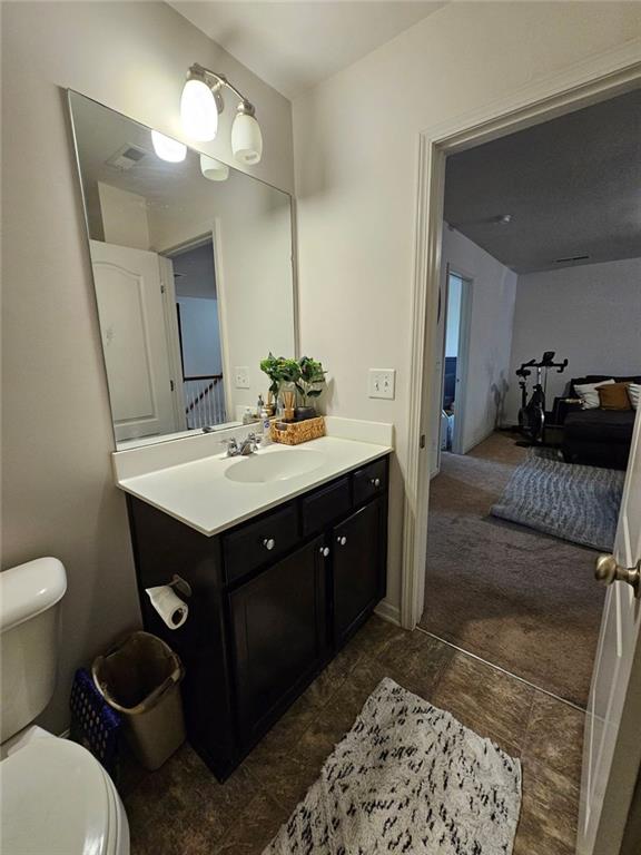 5747 Radford Loop Fairburn, GA 30213 - Photo 16 of 36 a bathroom with a sink vanity and a mirror