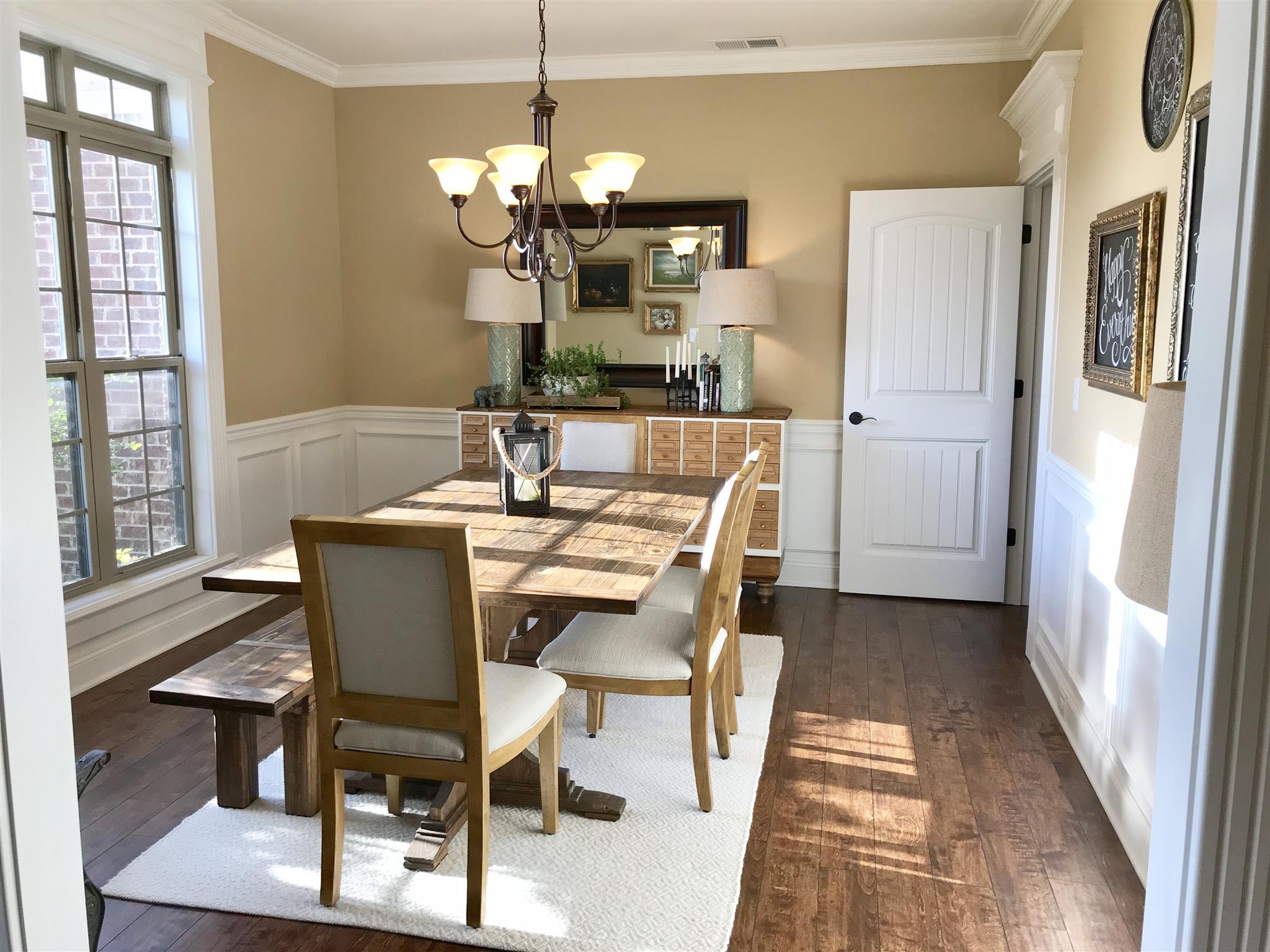 1235 Rimrock Road Smyrna, TN 37167 - Photo 3 of 28 Spacious dining room with wainscoting, wood floors, and floor to ceilings windows flooding the room with natural sunlight all day