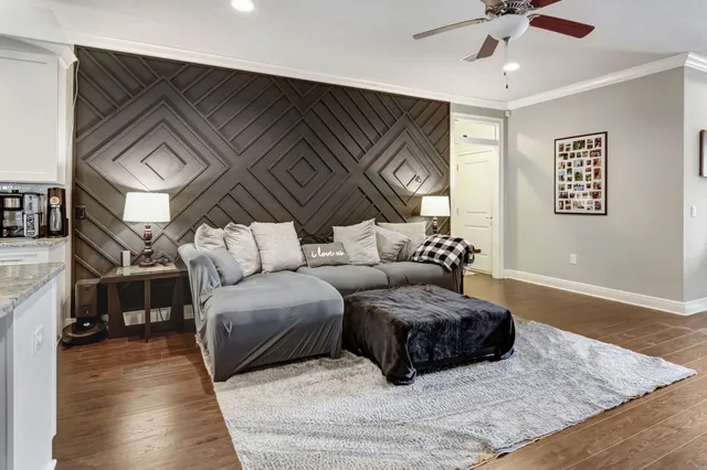 a living room with furniture and a rug