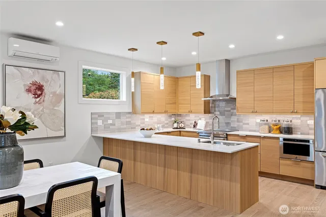 a kitchen with a sink a stove a refrigerator and a refrigerator