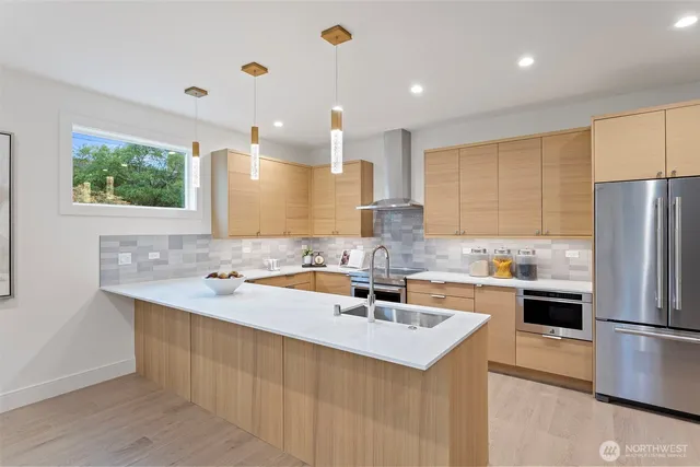 a kitchen with a sink stove and cabinets